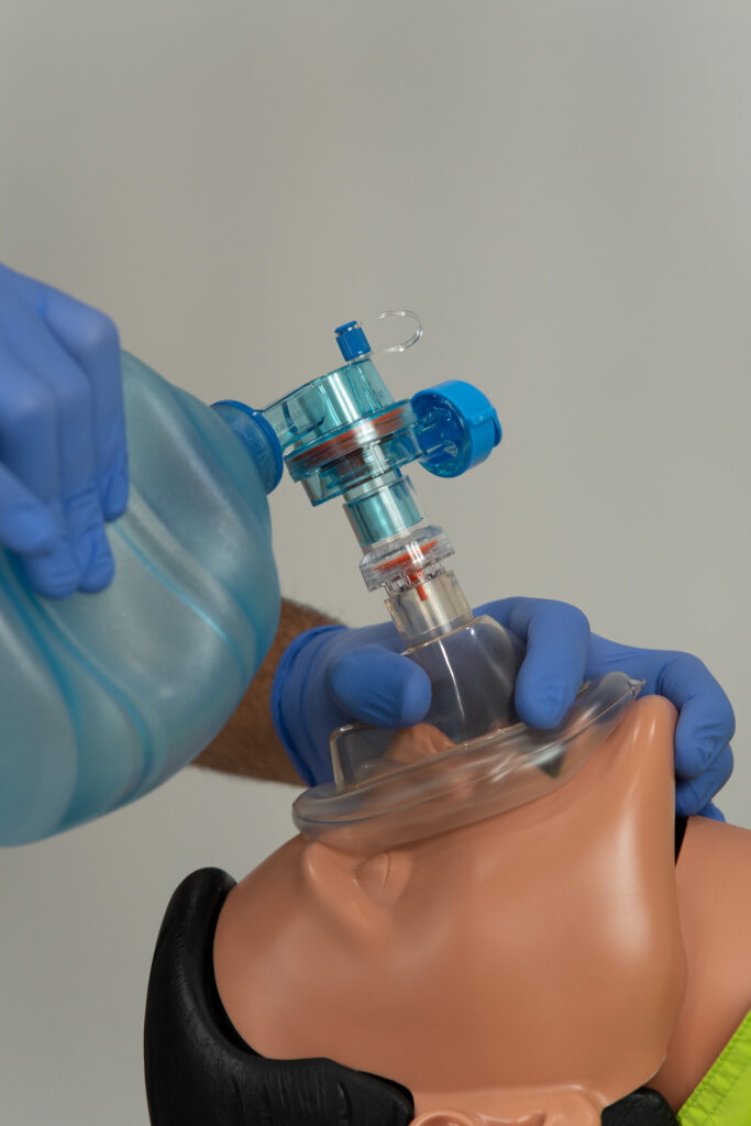 Medical training session — participants using life support device